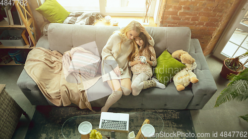 Image of Happy loving family, mother and daughter spending time together at home