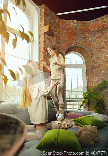Image of Happy loving family, mother and daughter spending time together at home