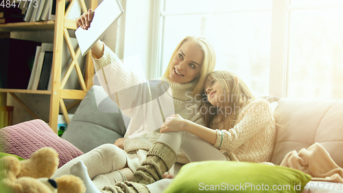 Image of Happy loving family, mother and daughter spending time together at home