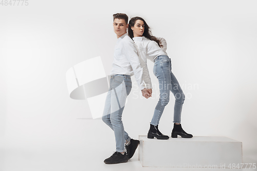 Image of Trendy fashionable couple isolated on white studio background