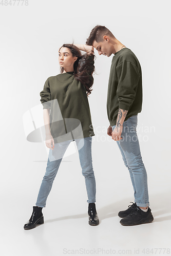 Image of Trendy fashionable couple isolated on white studio background