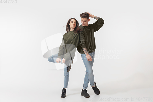 Image of Trendy fashionable couple isolated on white studio background