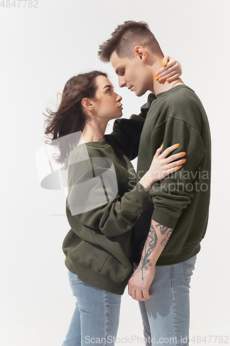 Image of Trendy fashionable couple isolated on white studio background