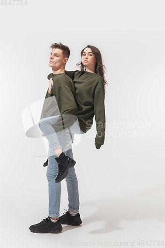 Image of Trendy fashionable couple isolated on white studio background