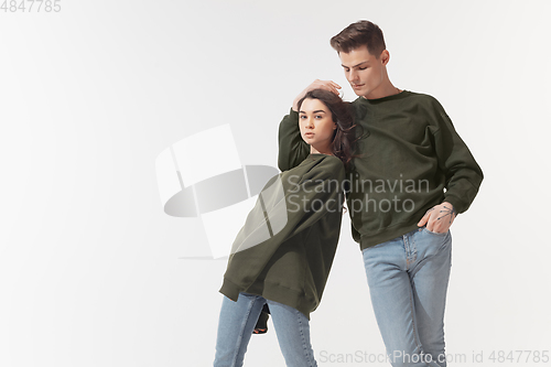 Image of Trendy fashionable couple isolated on white studio background