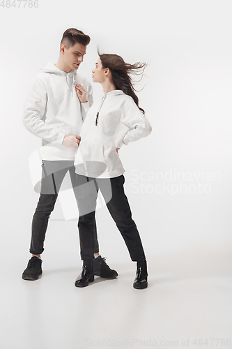 Image of Trendy fashionable couple isolated on white studio background