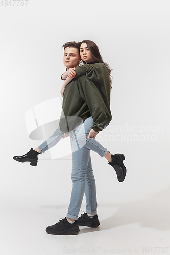 Image of Trendy fashionable couple isolated on white studio background