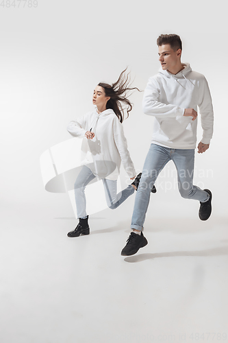 Image of Trendy fashionable couple isolated on white studio background