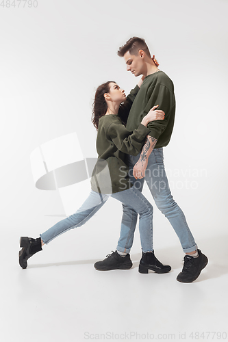 Image of Trendy fashionable couple isolated on white studio background