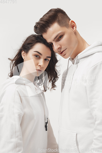 Image of Trendy fashionable couple isolated on white studio background