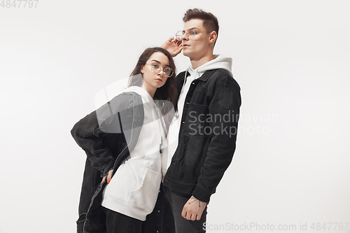 Image of Trendy fashionable couple isolated on white studio background