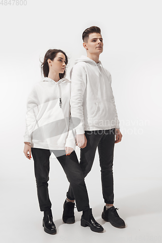 Image of Trendy fashionable couple isolated on white studio background