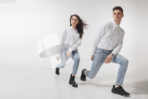 Image of Trendy fashionable couple isolated on white studio background