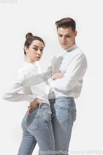 Image of Trendy fashionable couple isolated on white studio background