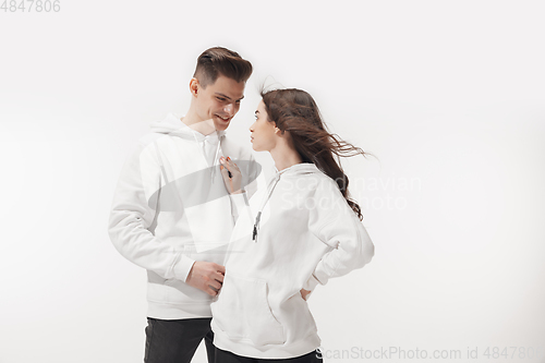 Image of Trendy fashionable couple isolated on white studio background