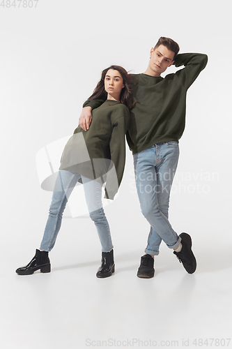 Image of Trendy fashionable couple isolated on white studio background