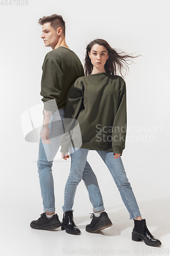 Image of Trendy fashionable couple isolated on white studio background