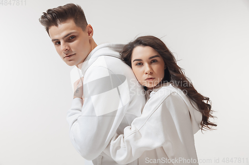 Image of Trendy fashionable couple isolated on white studio background