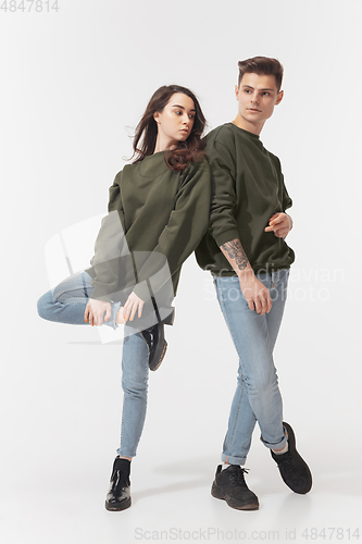 Image of Trendy fashionable couple isolated on white studio background