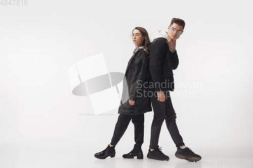 Image of Trendy fashionable couple isolated on white studio background