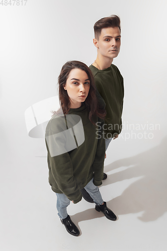 Image of Trendy fashionable couple isolated on white studio background