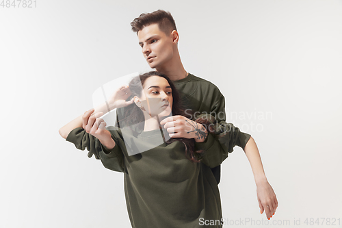 Image of Trendy fashionable couple isolated on white studio background