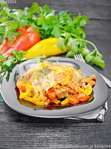 Image of Chicken with pepper in plate on napkin