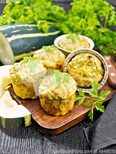 Image of Cupcake with cheese and zucchini on wooden board