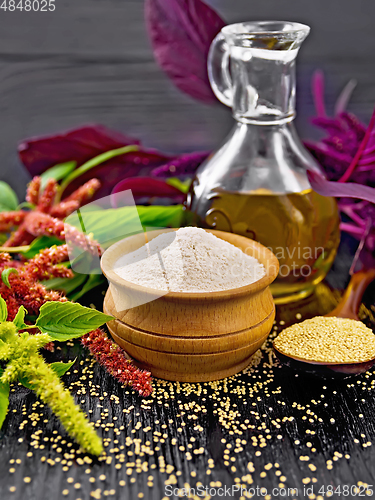 Image of Flour amaranth in bowl and oil on table