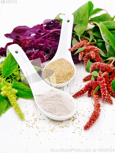 Image of Flour and seeds amaranth in spoons on light board