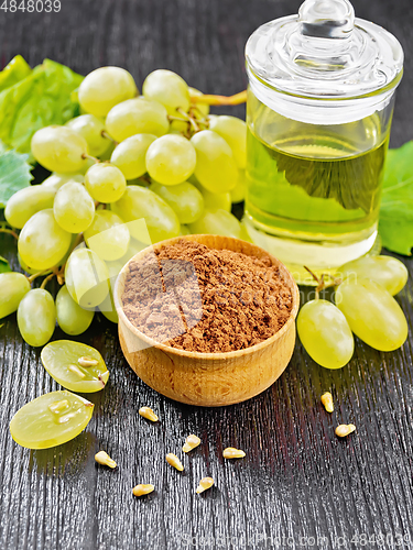 Image of Flour grape seed in bowl on wooden table