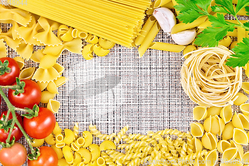Image of Frame of pasta on coarse woven fabric
