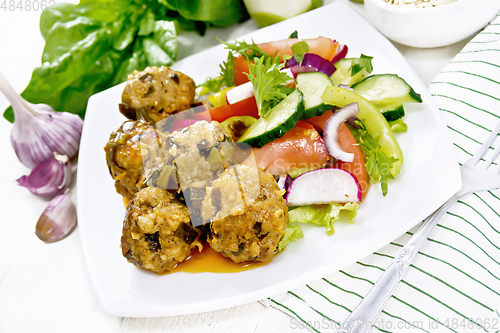 Image of Meatballs with spinach and oatmeal on light board