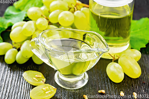 Image of Oil grape in gravy boat on board