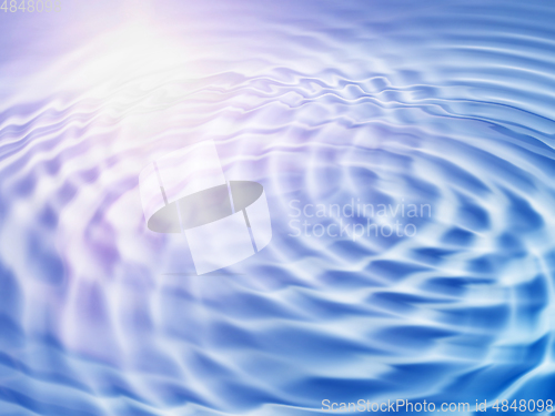 Image of Abstract background with wavy ripples and sunlight