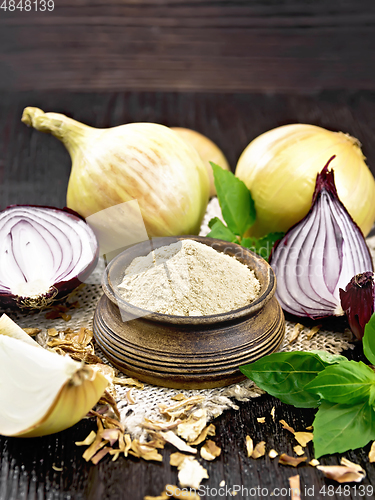 Image of Onion powder in bowl on board