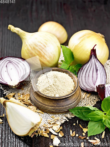 Image of Onion powder in bowl on burlap