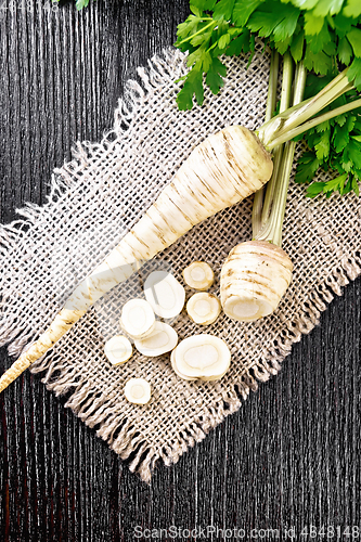 Image of Parsley root chopped on dark board top