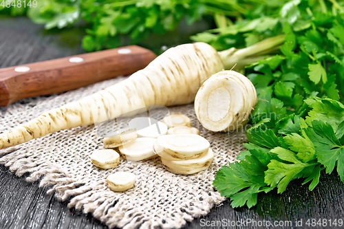 Image of Parsley root chopped on dark board