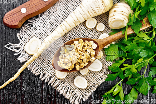 Image of Parsley root dried in spoon on board top