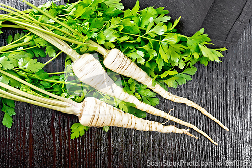 Image of Parsley root with leaf on board top