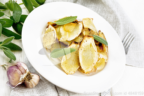 Image of Parsnips baked in plate on white wooden board