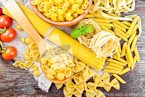 Image of Pasta different with tomatoes on board top