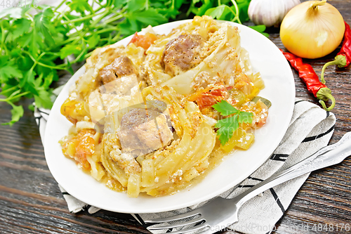 Image of Pasta with meatballs in plate on towel