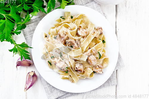 Image of Pasta with salmon and cream on board top