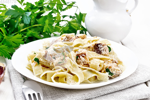 Image of Pasta with salmon and cream on board