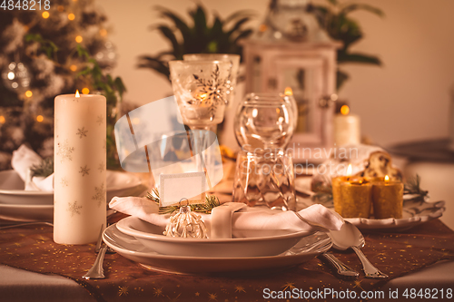 Image of Festive Christmas table in golden tone