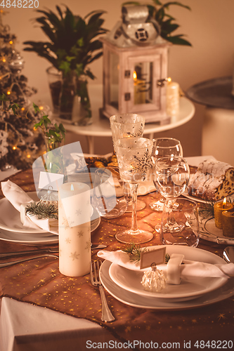 Image of Festive Christmas table in golden tone