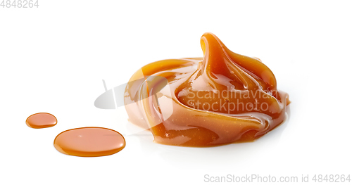 Image of melted caramel on white background