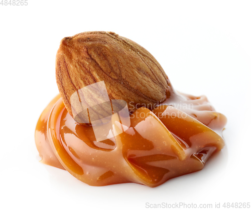 Image of almond in melted caramel